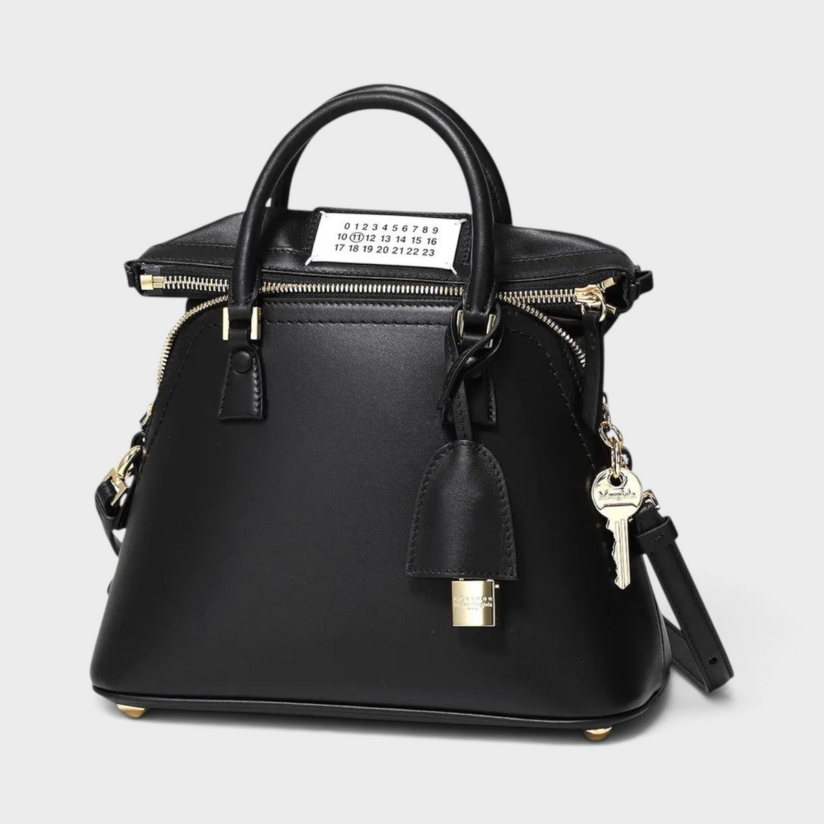 Supplied Fashion Maison Margiela 5AC mini tote bag in black leather with signature numeric logo and gold key charm