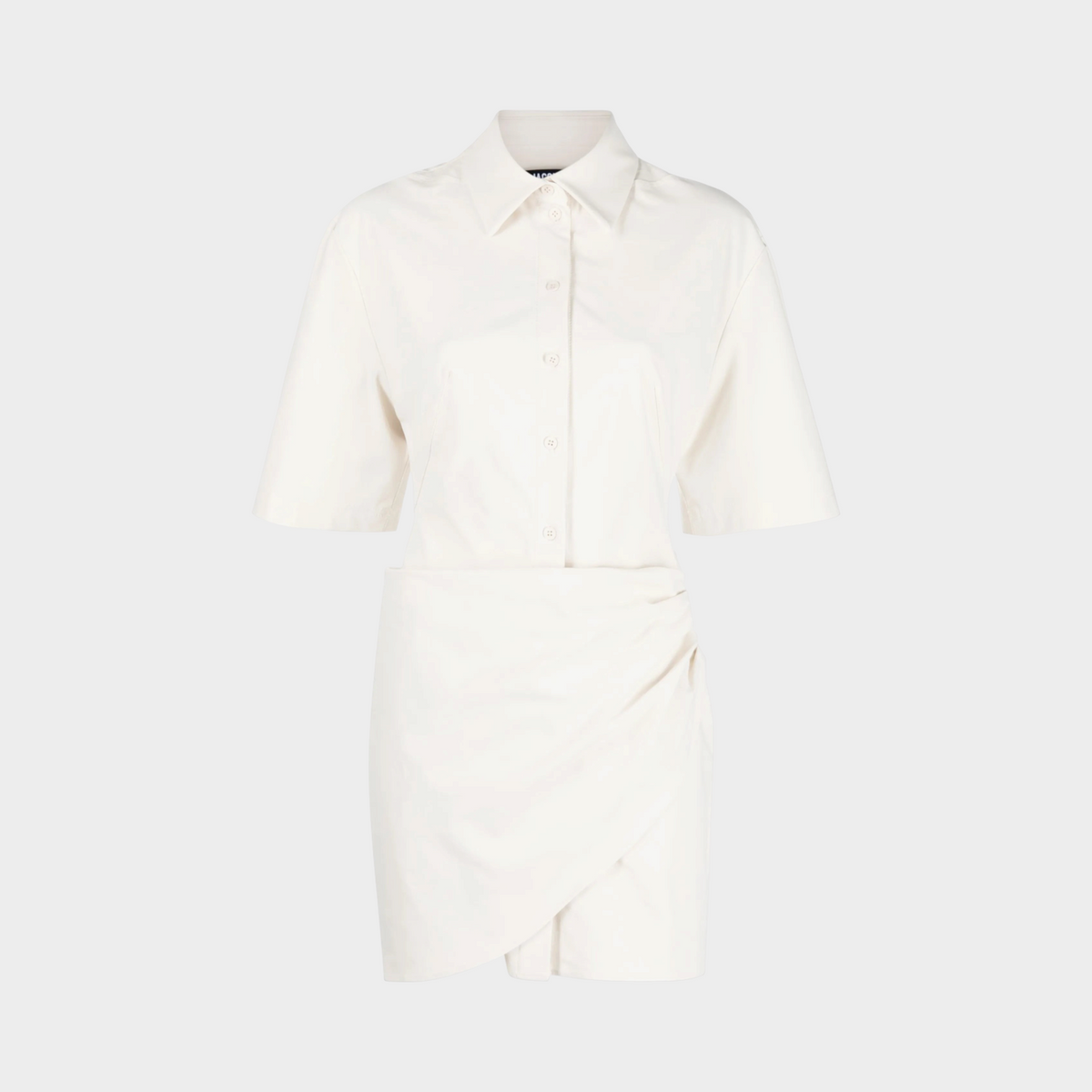 Supplied Fashion La Robe Camisa ivory shirt dress with a relaxed fit, short sleeves, and a draped wrap-style skirt.