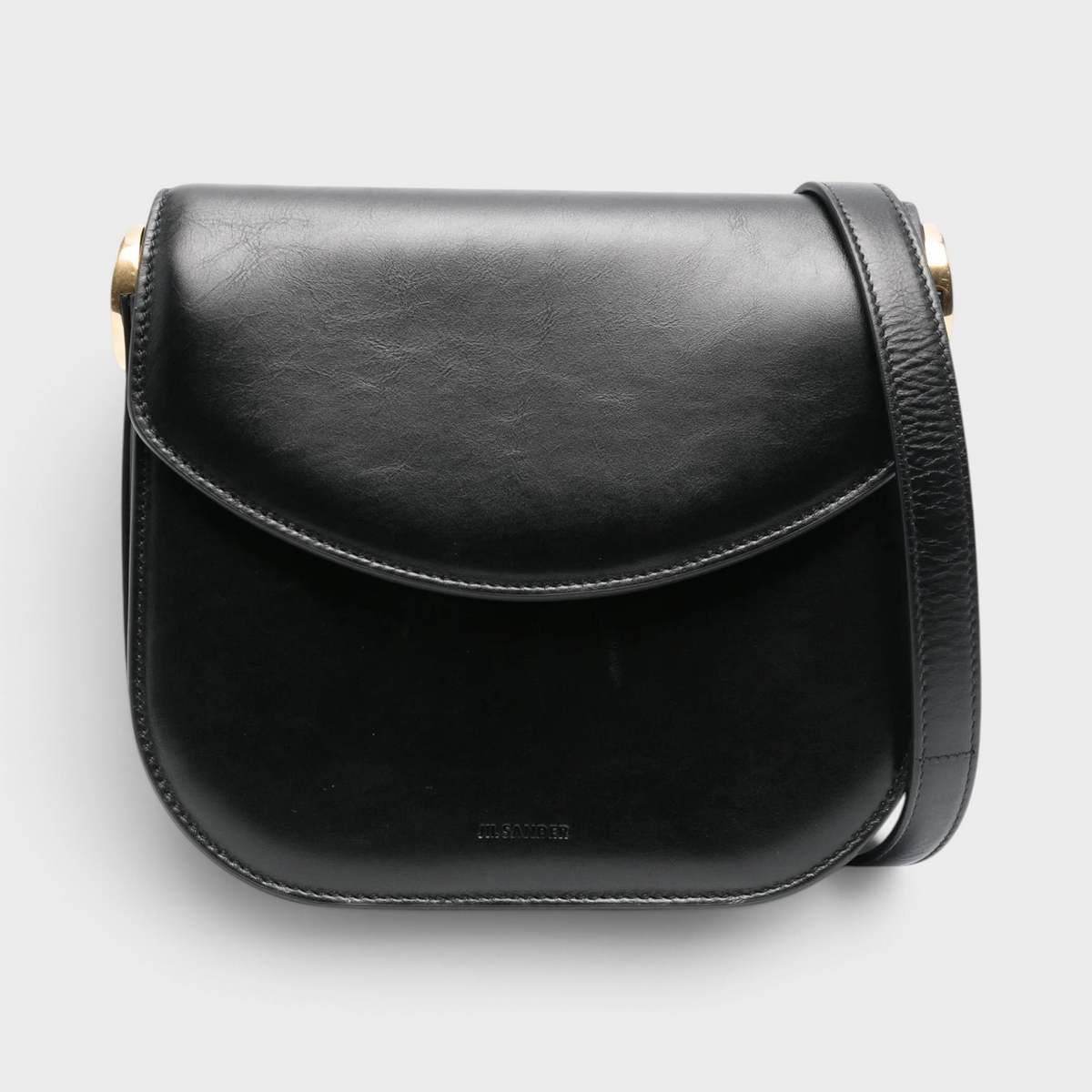 Supplied Fashion Medium Coin black leather crossbody bag with a structured silhouette and minimalist design.