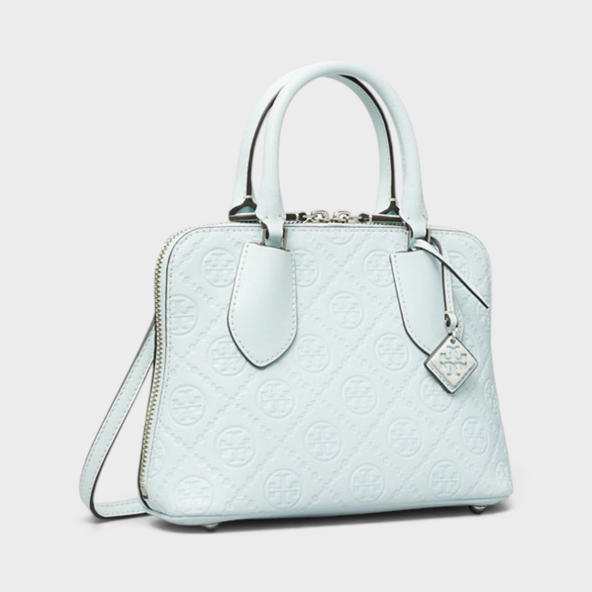 Supplied Fashion ice blue leather mini swing bag with embossed monogram T logo and silver hardware