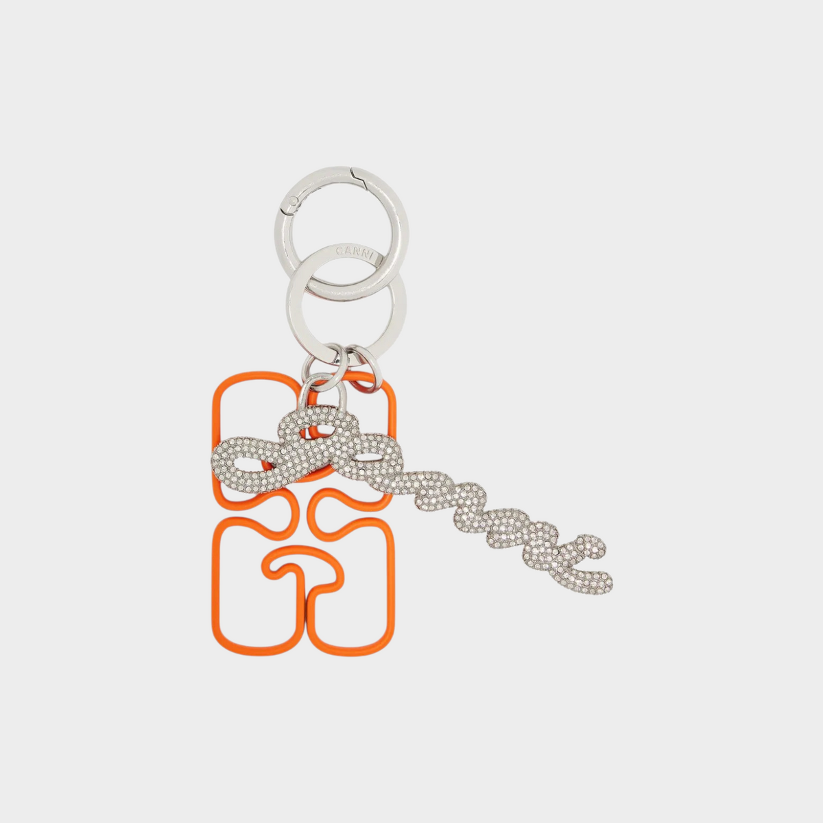 Supplied Fashion GANNI russet orange keyring with silver-tone chain embellishment and crystal-studded logo charm.