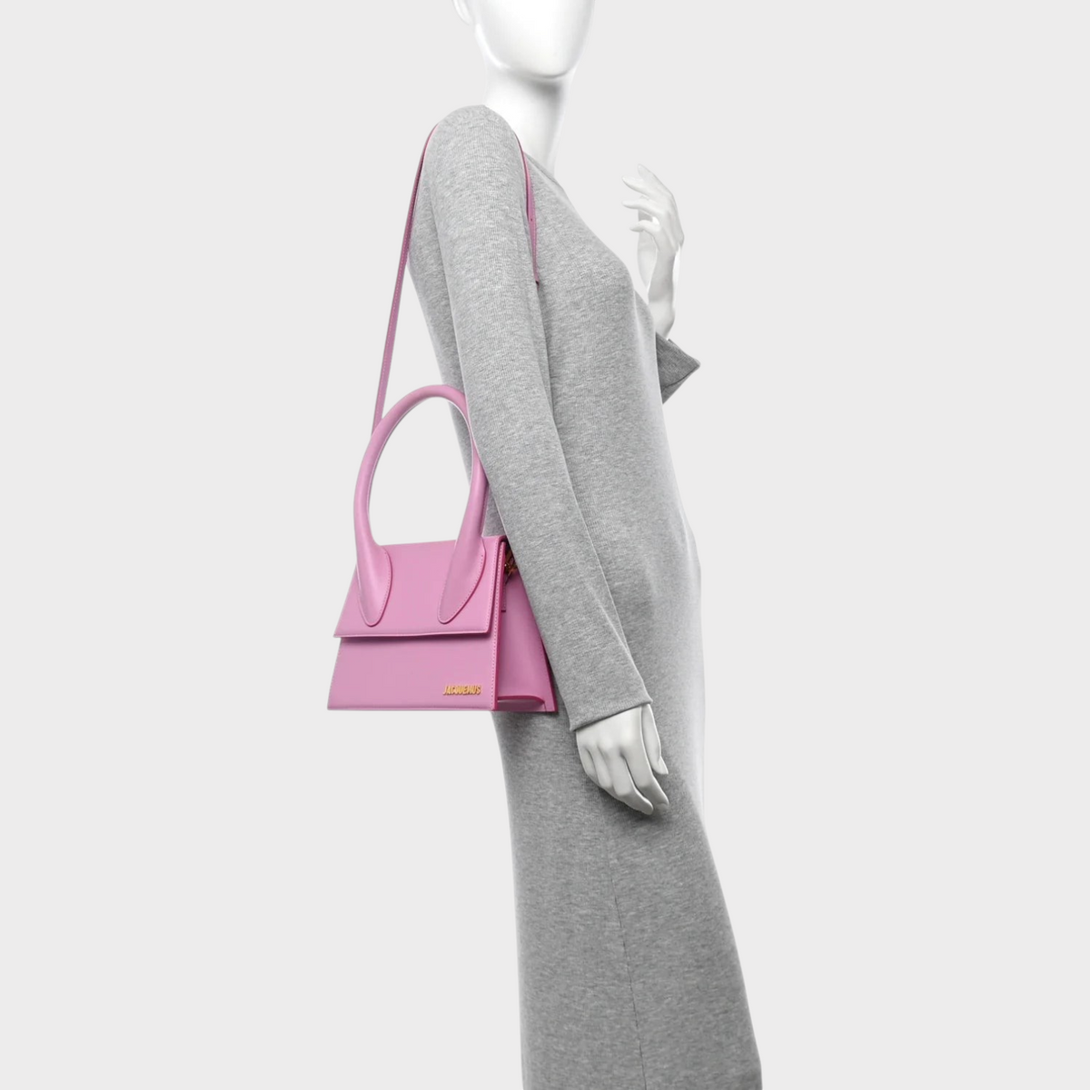 Supplied Fashion Le Grand Chiquito light pink structured leather handbag worn on a mannequin shoulder