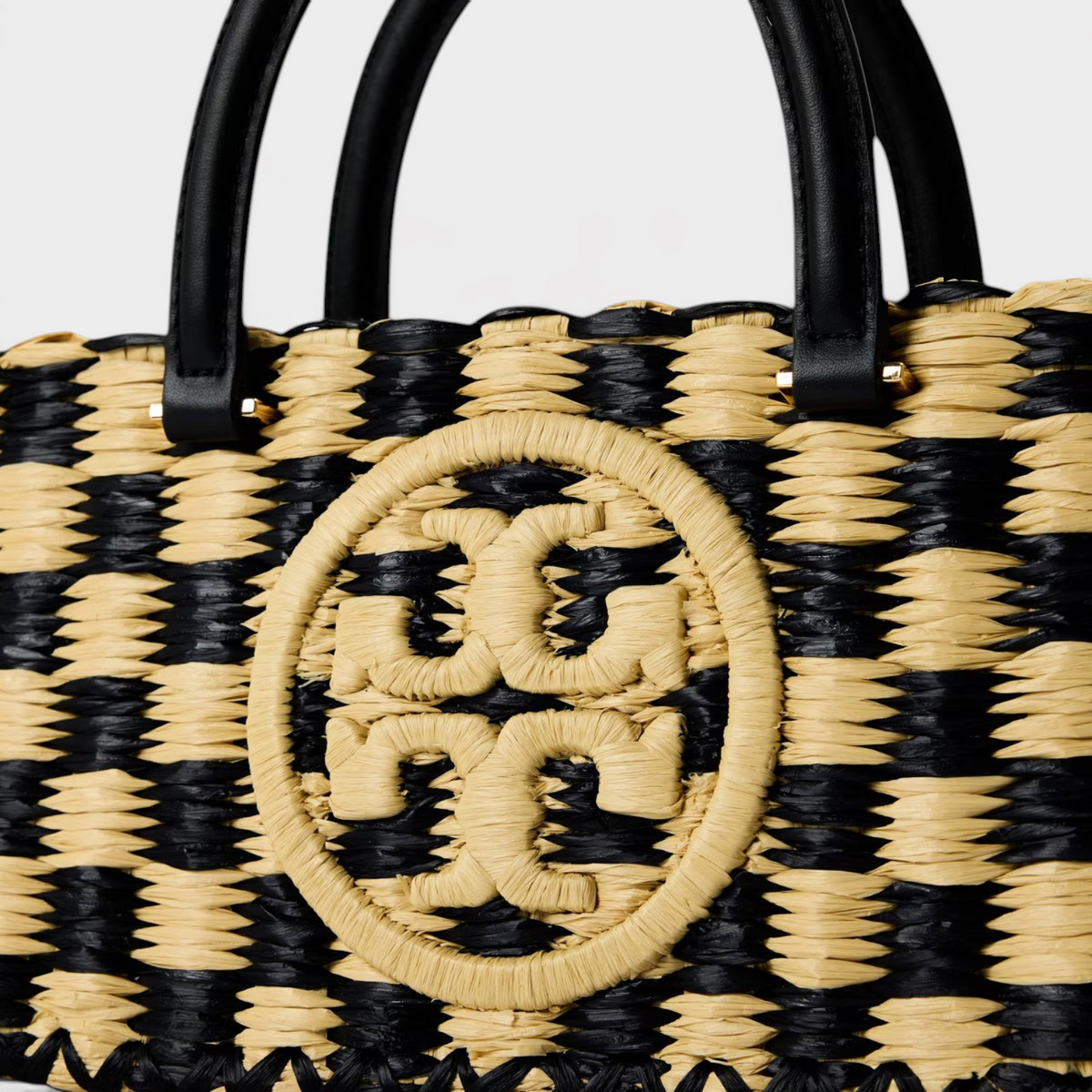 Supplied Fashion hand-crocheted checkered tote bag in black and natural straw with a prominent circular logo emblem.
