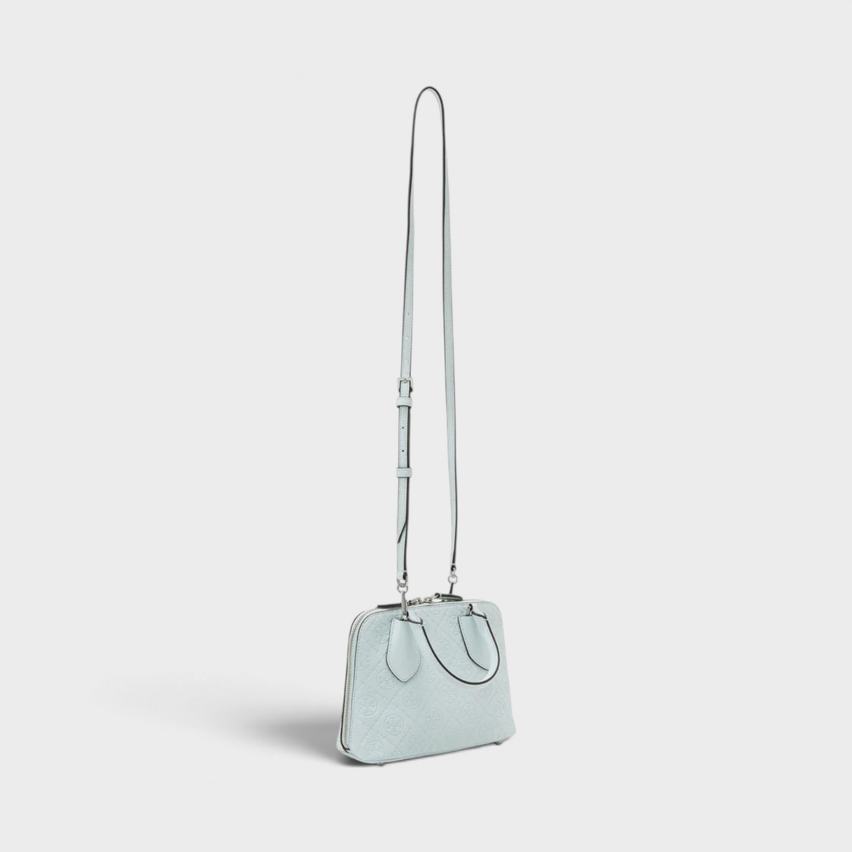 Supplied Fashion ice blue leather mini swing bag with monogram T logo and adjustable shoulder strap