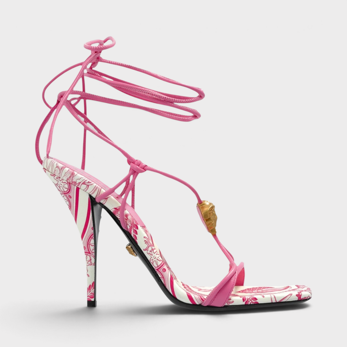 Supplied Fashion pink and white square-toe heeled sandals with lace-up ankle ties and gold Medusa hardware.