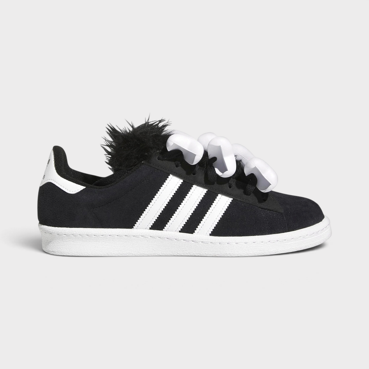 Supplied Fashion Jeremy Scott Campus 80 black suede trainers with white bone lace accessories and faux fur tongue