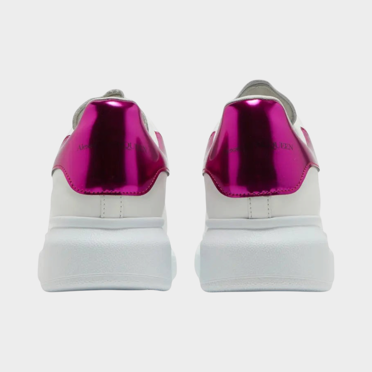 Supplied Fashion kids oversized white sneakers with metallic pink heel tabs, viewed from the back.