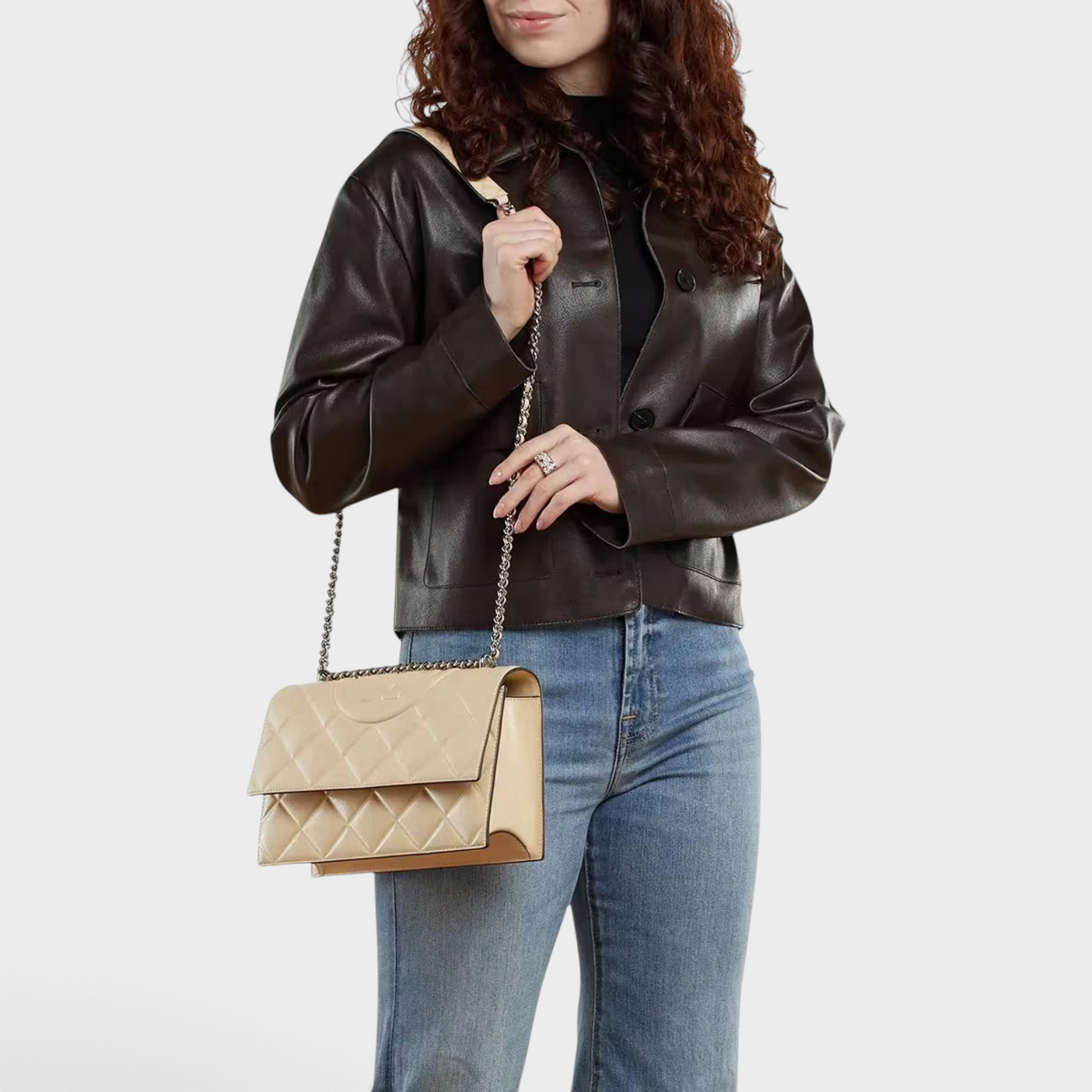 Supplied Fashion vanilla beige quilted leather Fleming convertible shoulder bag with chain strap worn by a woman
