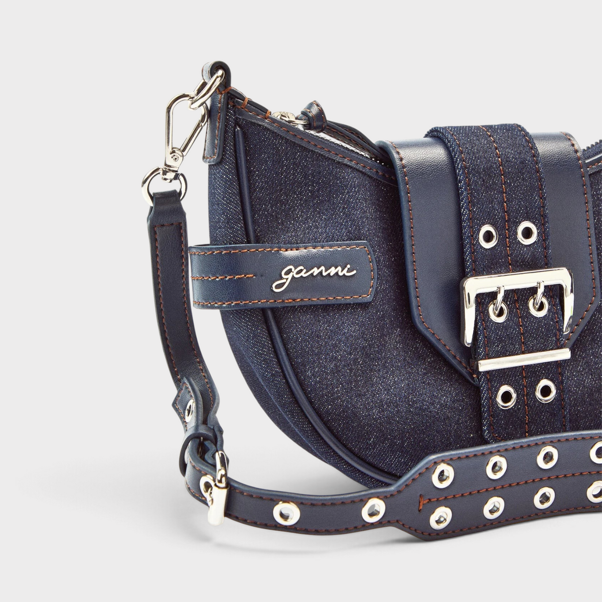 Supplied Fashion GANNI Bucky small crossbody bag in dark blue denim with silver buckle and adjustable strap