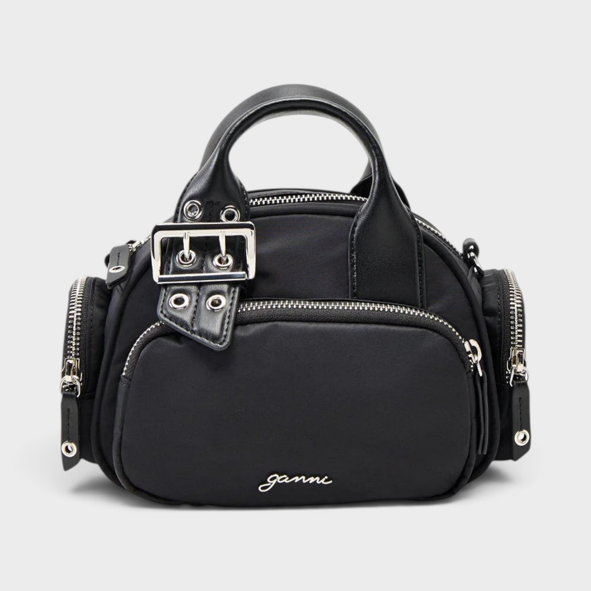Supplied Fashion Bucky Polochon small black satchel with silver buckle detail, top handle, and zippered side pockets.