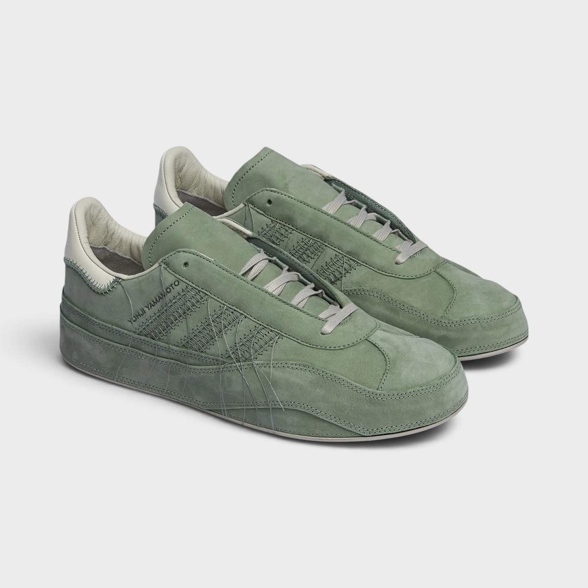 Supplied Fashion Adidas x Y-3 Gazelle sneakers in silver green suede with signature Yohji Yamamoto stitching details.