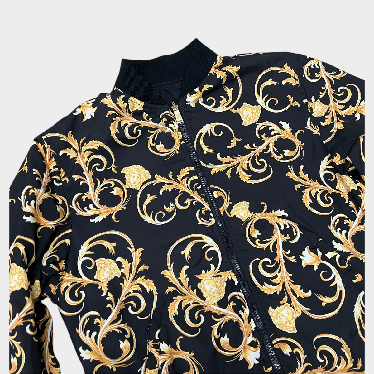Supplied Fashion reversible bomber jacket in black with a luxurious gold Baroque print and ribbed collar.