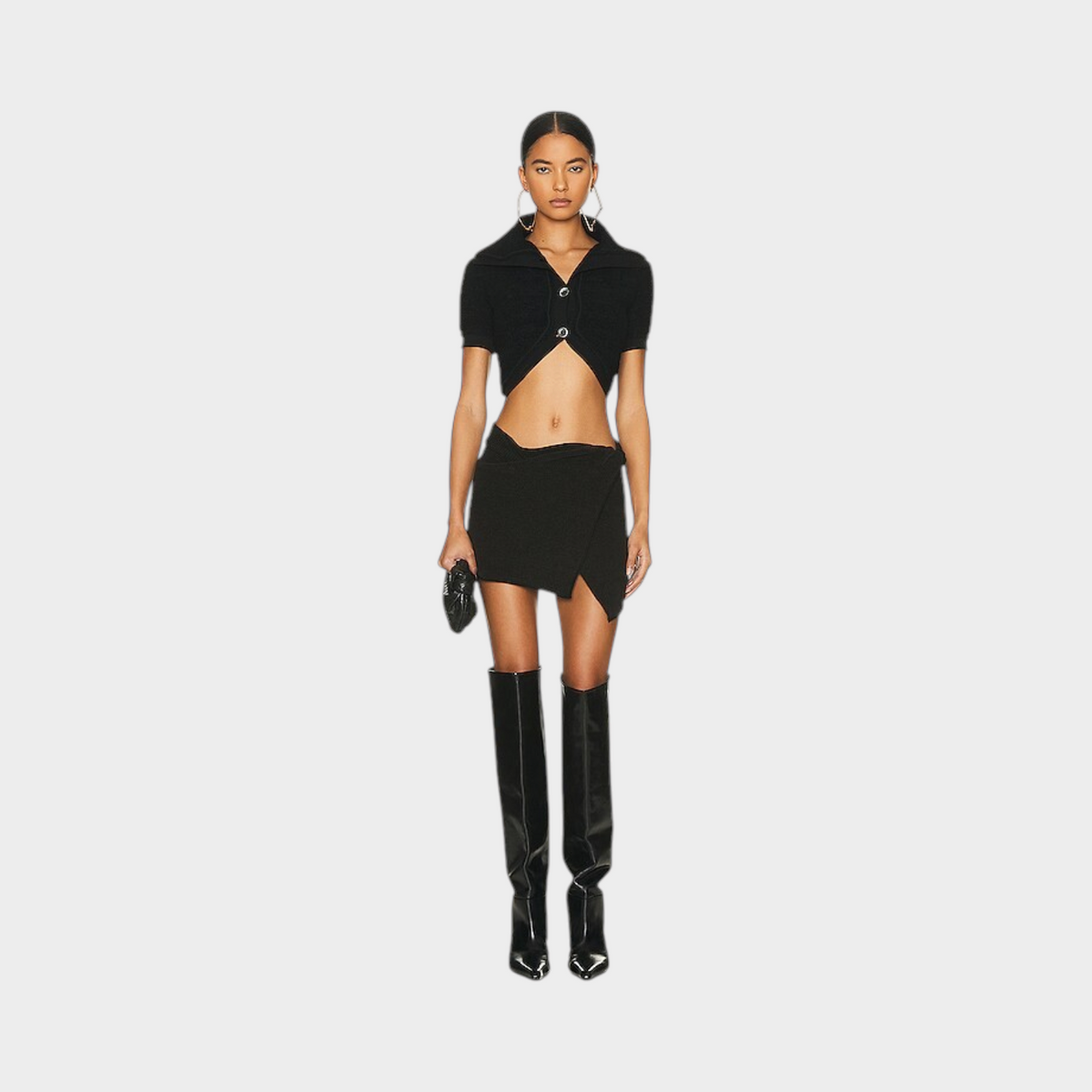 Supplied Fashion black wool blend cropped cardigan with a collar and button front worn by a model