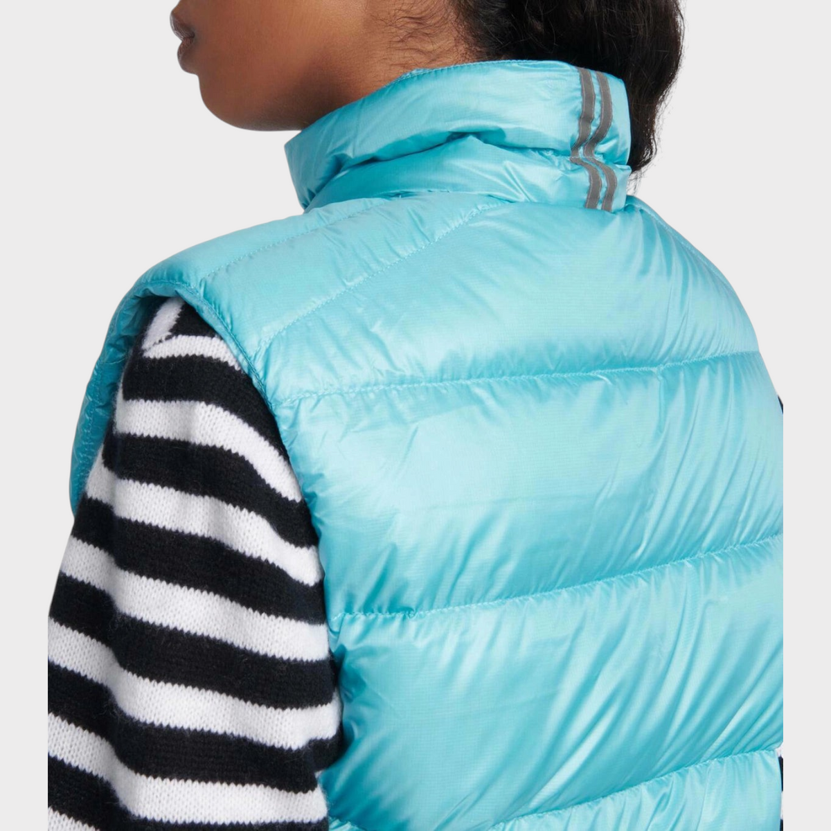 Supplied Fashion Canada Goose Cypress down vest in boulevard blue with a high collar and reflective back detail