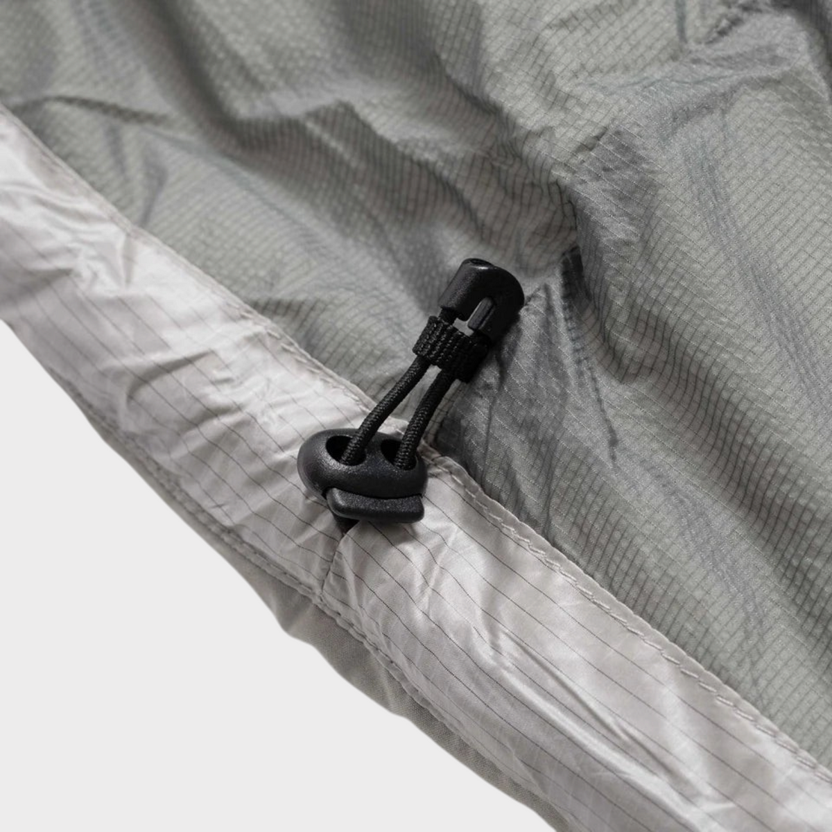 Supplied Fashion Waves Light Puffer in grey featuring a black adjustable drawstring toggle on the hem