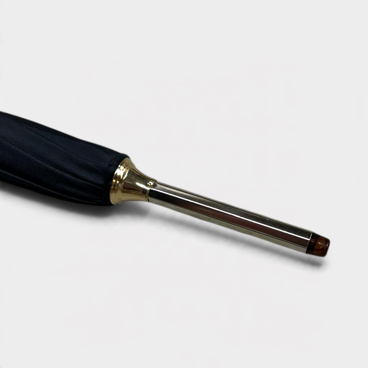 Supplied Fashion Alexander McQueen black umbrella with a metallic handle and wood detailing on the tip