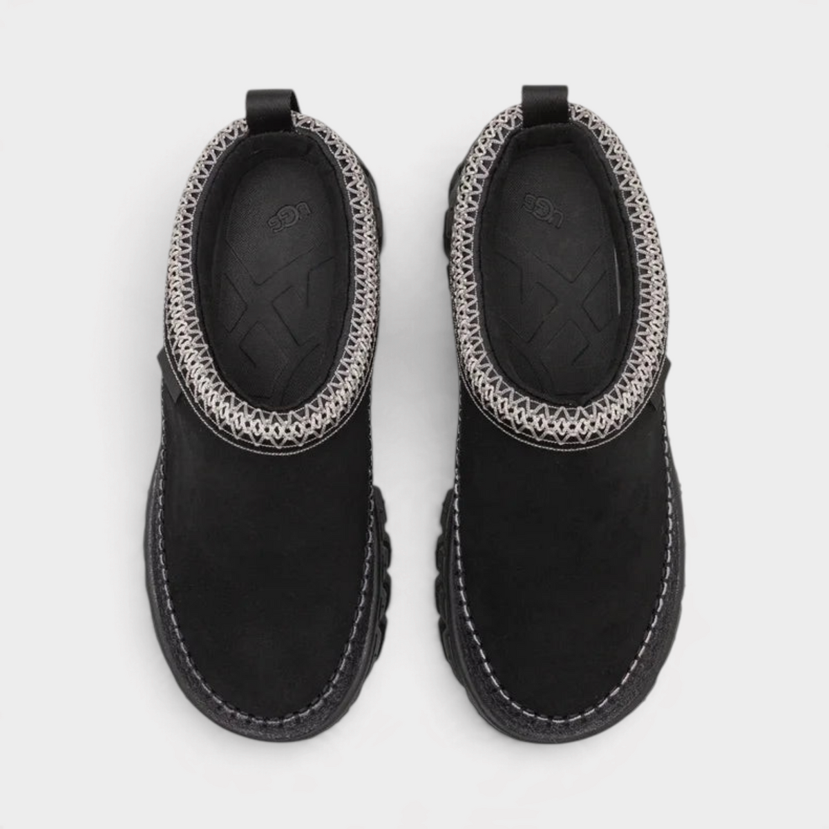 Supplied Fashion Venture Daze black slip-on shoes with a patterned grey collar and durable rubber sole.