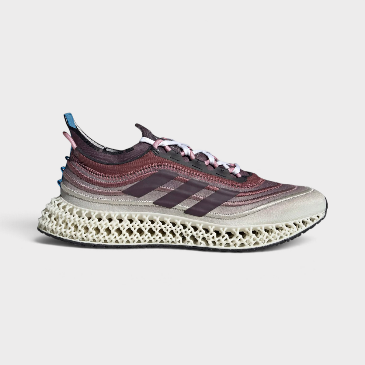 Supplied Fashion adidas 4DFWD X Parley running trainers featuring a maroon and cream lattice midsole and mesh upper.