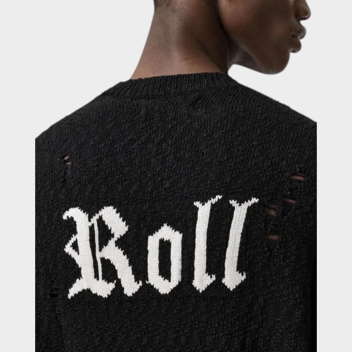Supplied Fashion black jacquard knit jumper featuring white gothic Roll lettering and distressed detailing on back
