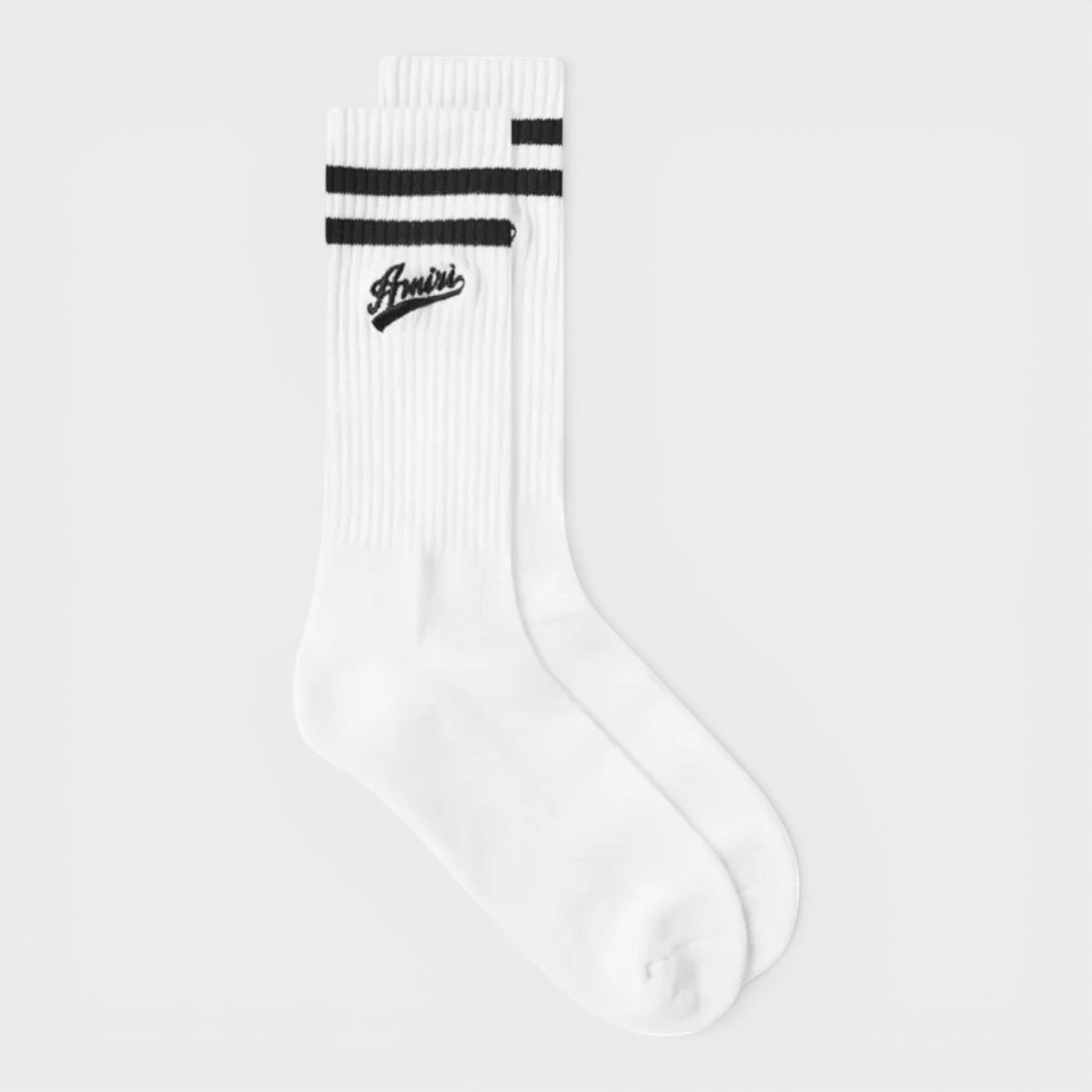 White sock with black stripes on a light gray background
