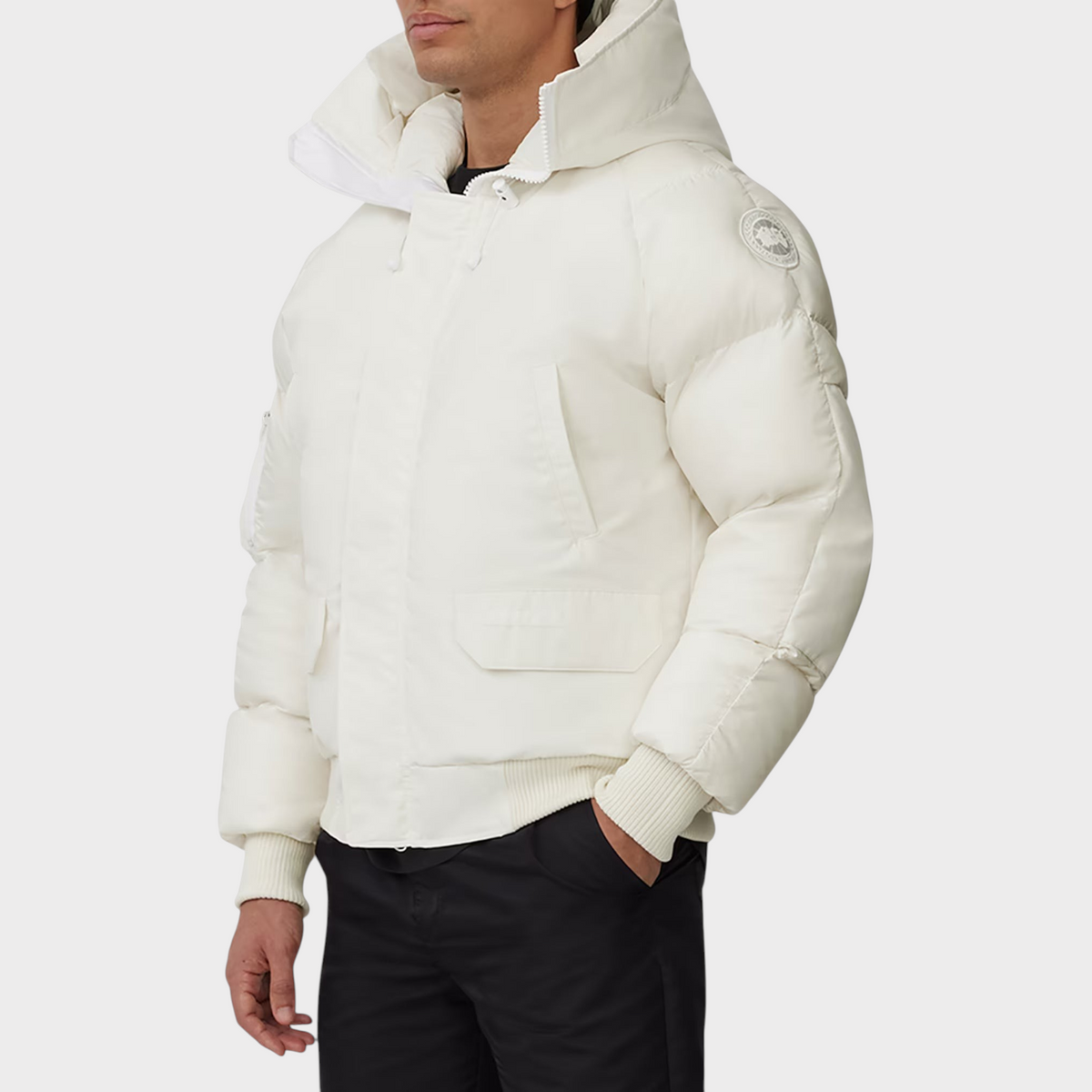 Supplied Fashion Paradigm Chilliwack white down bomber jacket with a hood and ribbed cuffs worn by a man