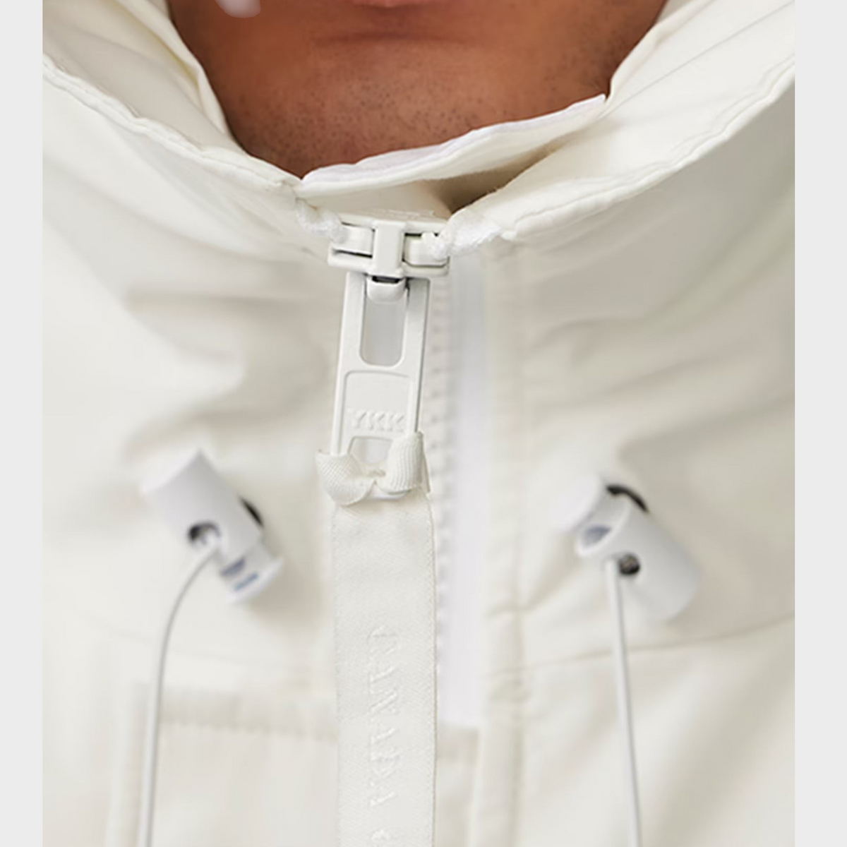 Supplied Fashion Paradigm Chilliwack white down bomber jacket featuring a high collar and durable YKK zipper detail.