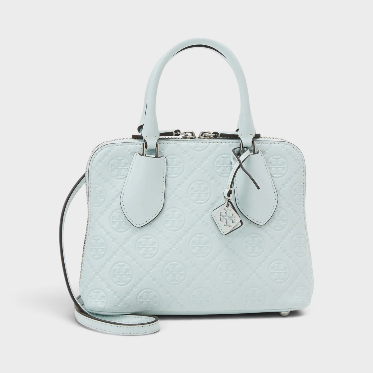 Supplied Fashion ice blue leather mini swing bag with embossed monogram T logo and adjustable shoulder strap