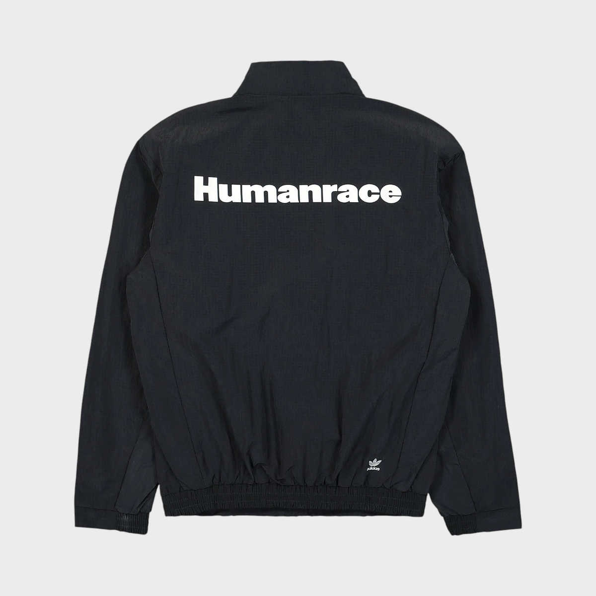 Supplied Fashion black adidas Pharrell Williams Humanrace track jacket with white back logo, back view