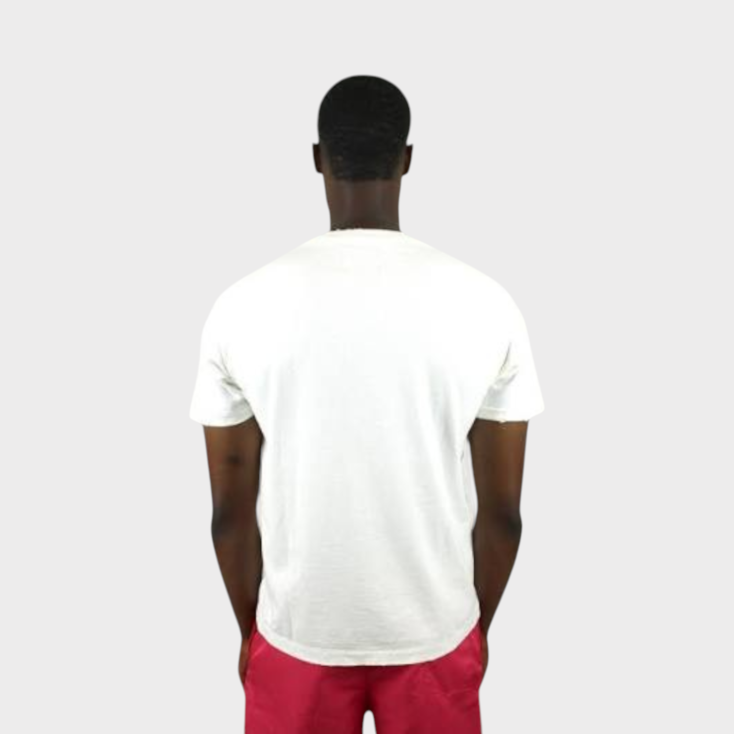Supplied Fashion white vintage cotton t-shirt worn by a man, back view showing relaxed fit and worn-in texture.