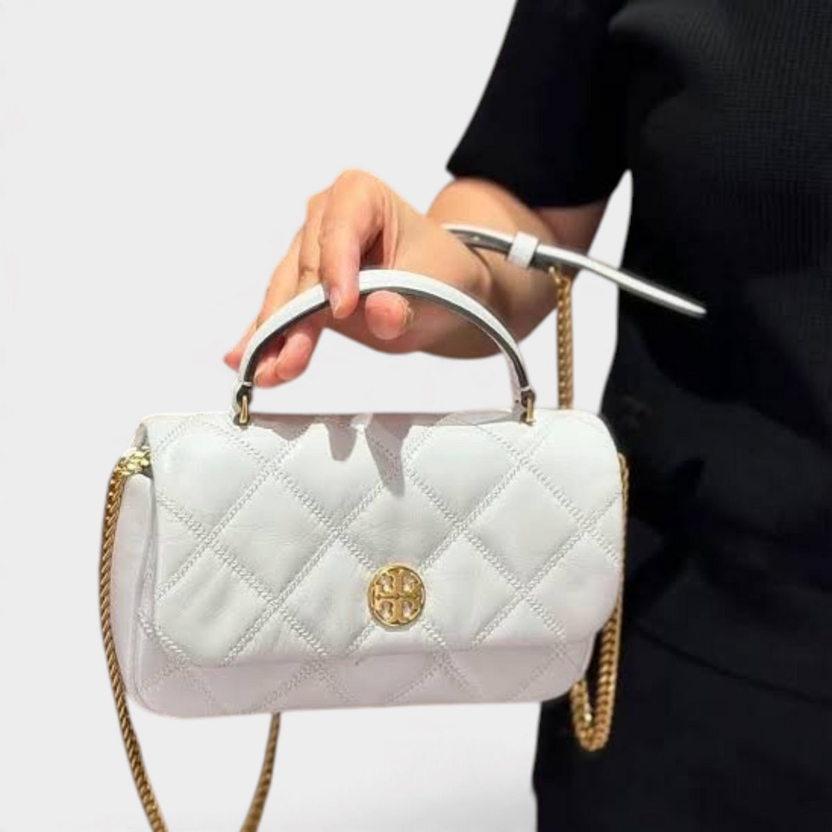 Supplied Fashion Willa white glazed leather mini top handle bag with gold chain strap and quilted texture