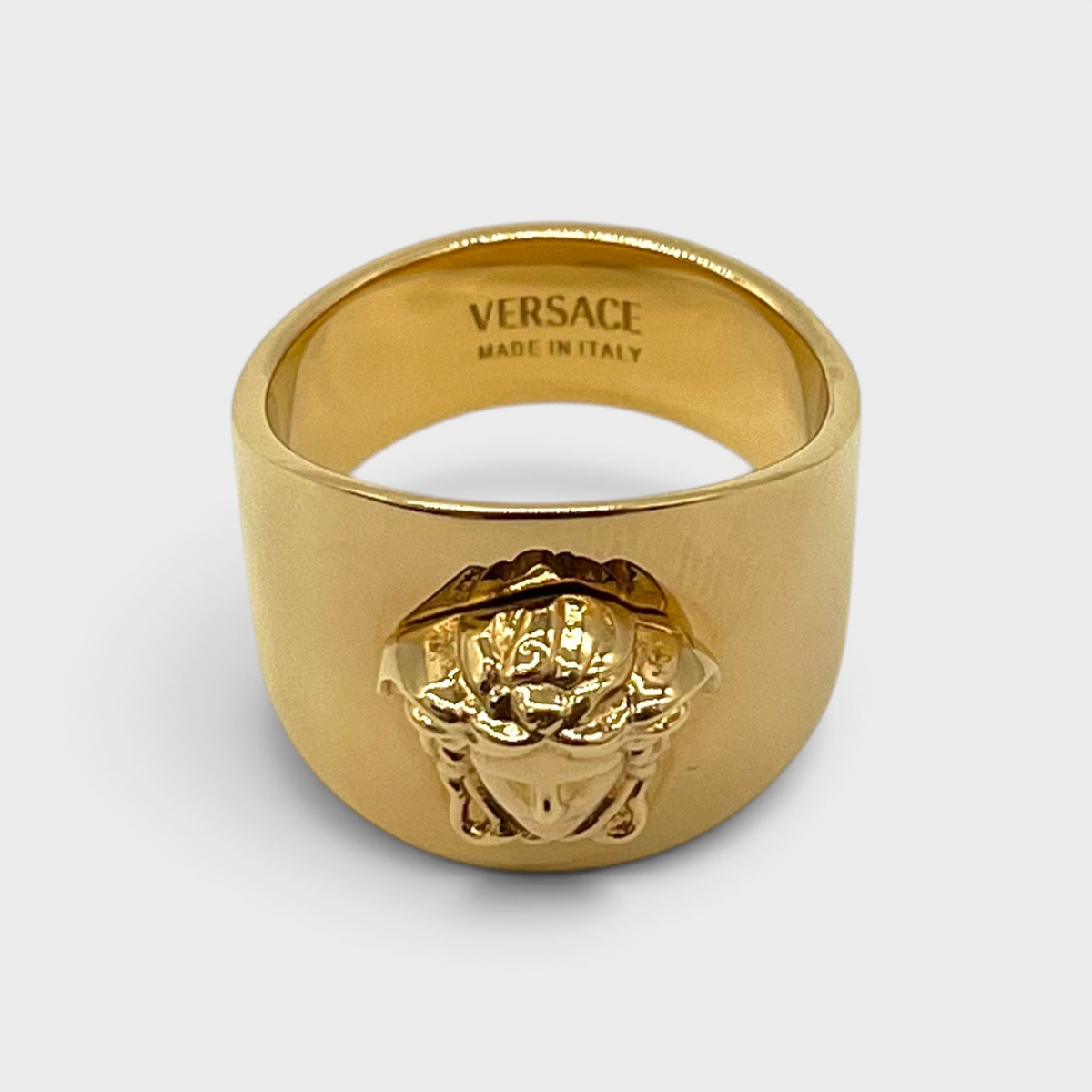 Supplied Fashion gold Medusa head statement ring with polished finish and engraved interior detail