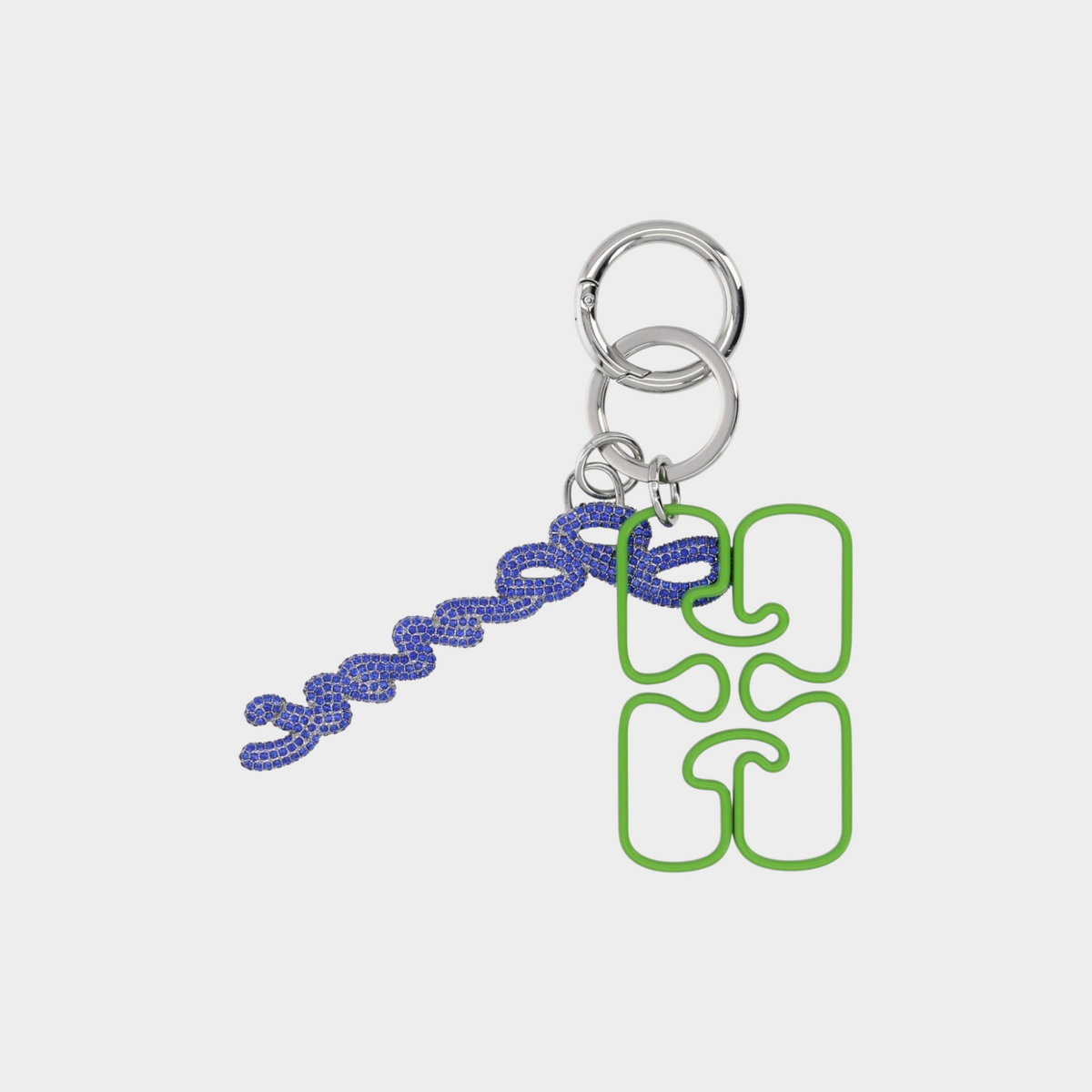 Supplied Fashion Ganni keyring with blue crystal chain and flash green puzzle-shaped charm on silver rings.