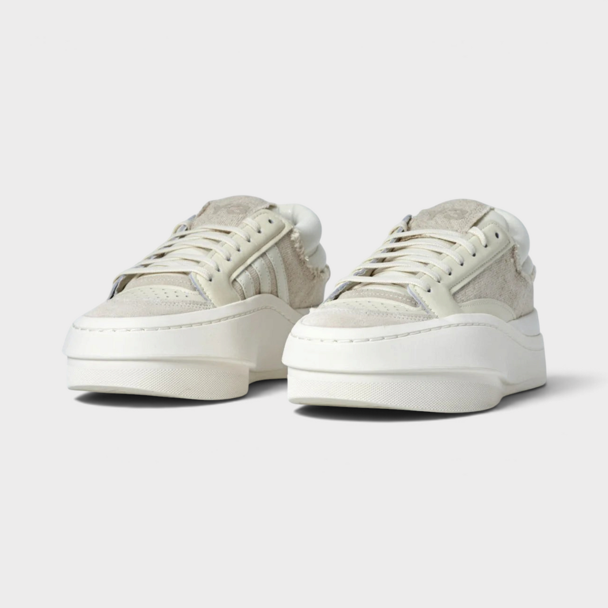 Supplied Fashion Adidas x Y-3 Centennial Low trainers in off-white leather with a chunky midsole and minimalist design.
