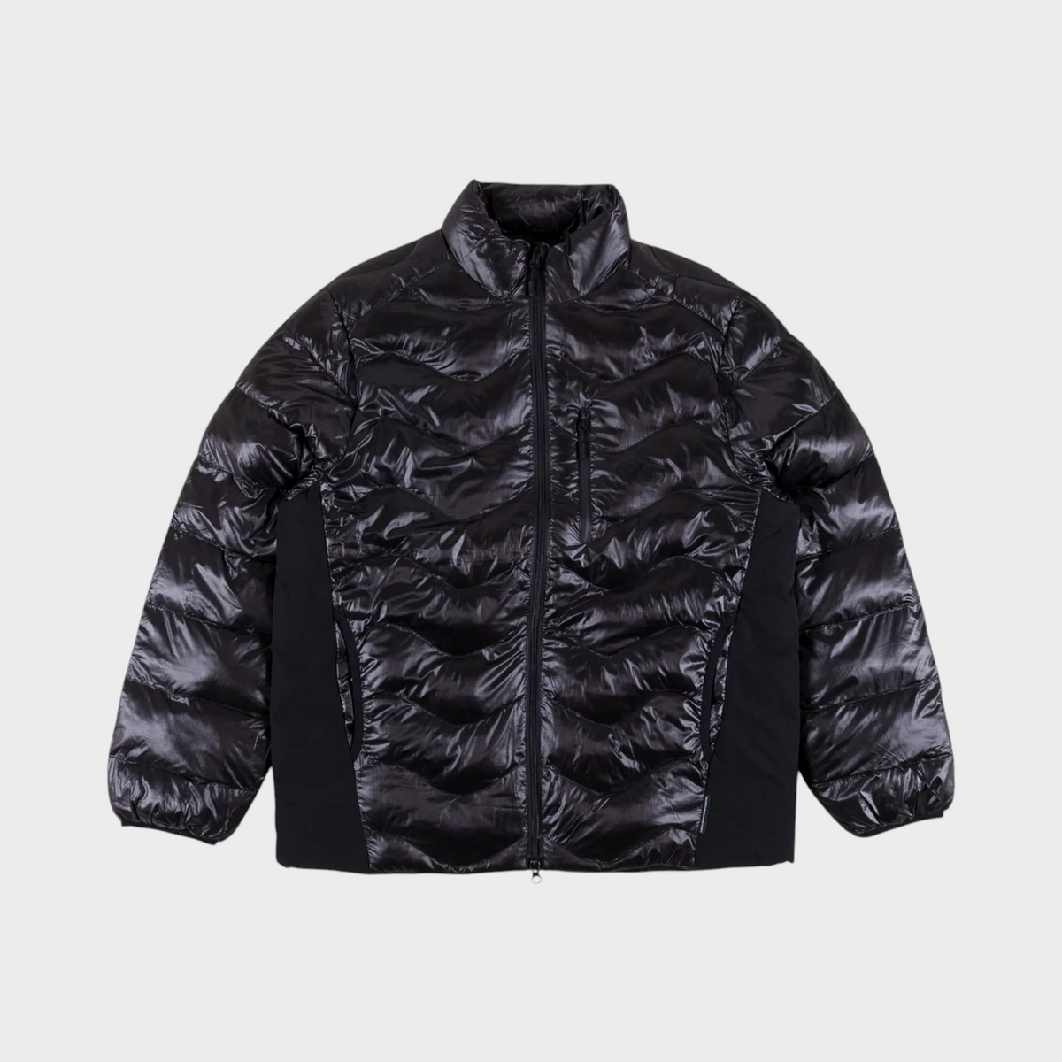 Supplied Fashion Waves Light Puffer Jacket in black with a modern quilted design and zip-up front closure.