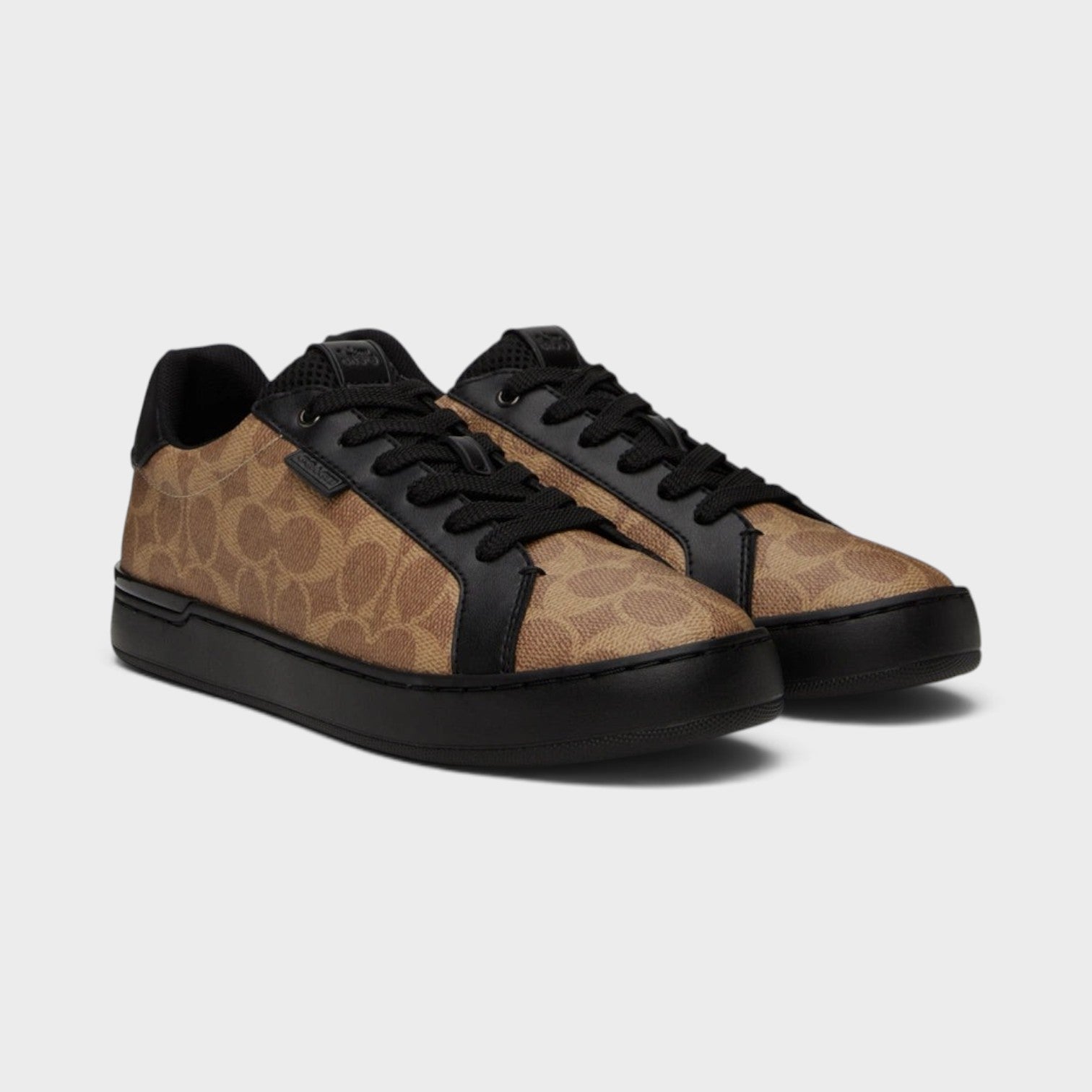 Supplied Fashion 1941 Lowline low-top sneakers in brown signature monogram print with black leather and rubber soles.