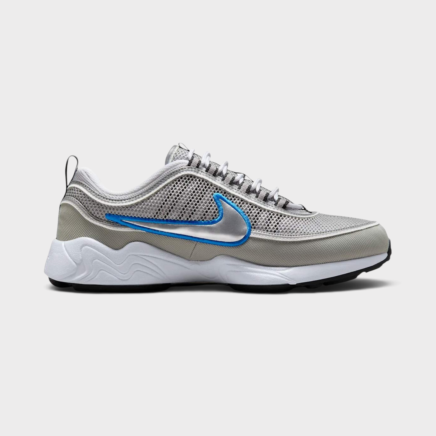 Supplied Fashion Air Zoom Spiridon SP sneakers in metallic silver and grey with a blue outlined swoosh logo.