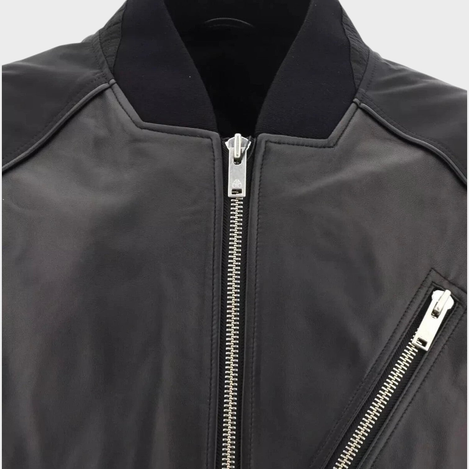 Supplied Fashion Anica black leather bomber jacket with a ribbed collar and silver zippered chest pocket