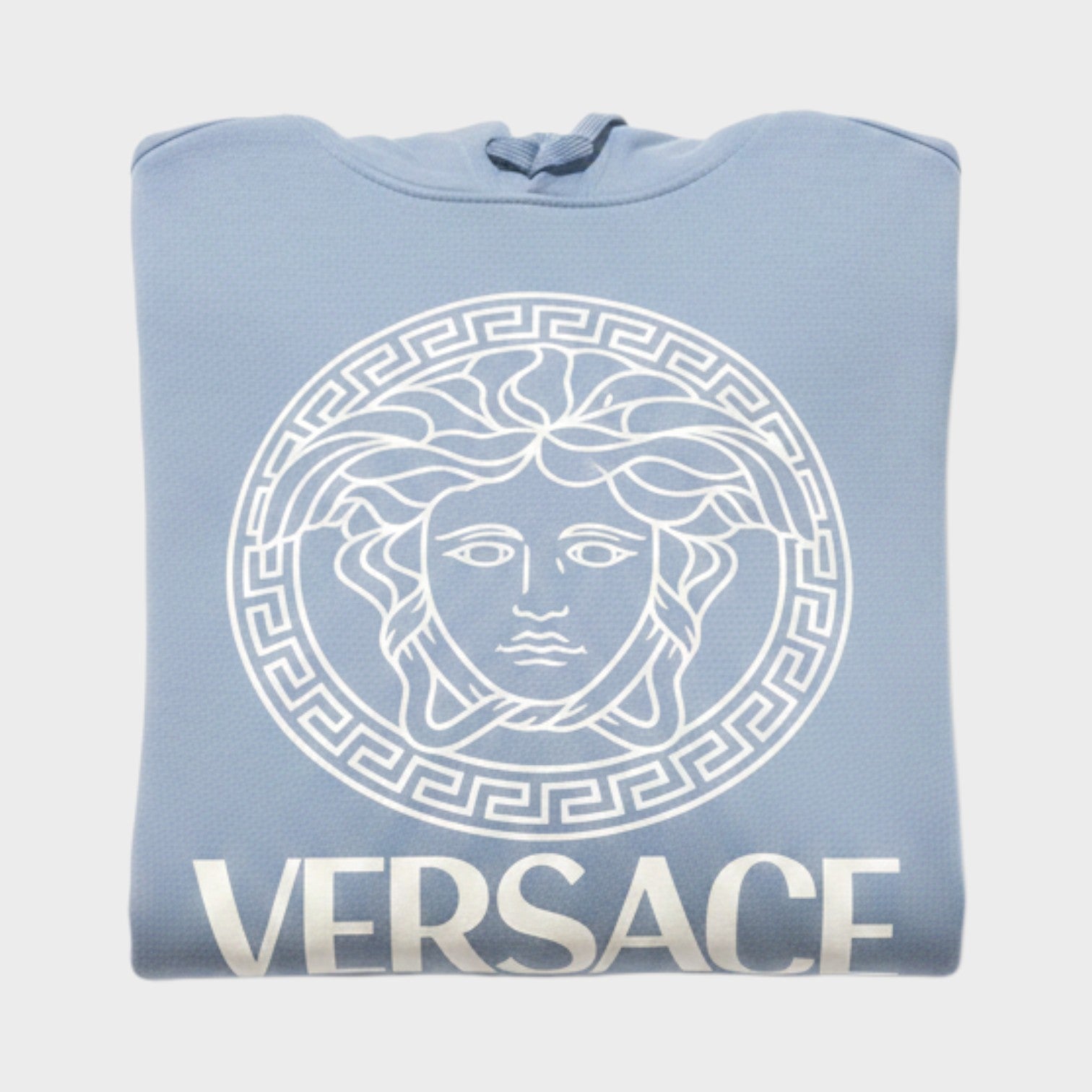 Supplied Fashion baby blue hoodie featuring a white Medusa logo and Versace text in a folded flat lay view.