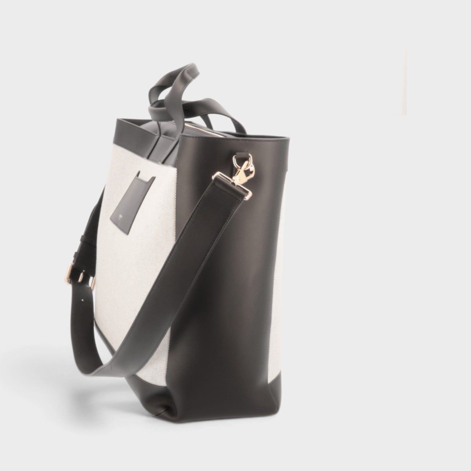 Supplied Fashion Burberry Ormond two-way tote bag in beige canvas and black leather with side view