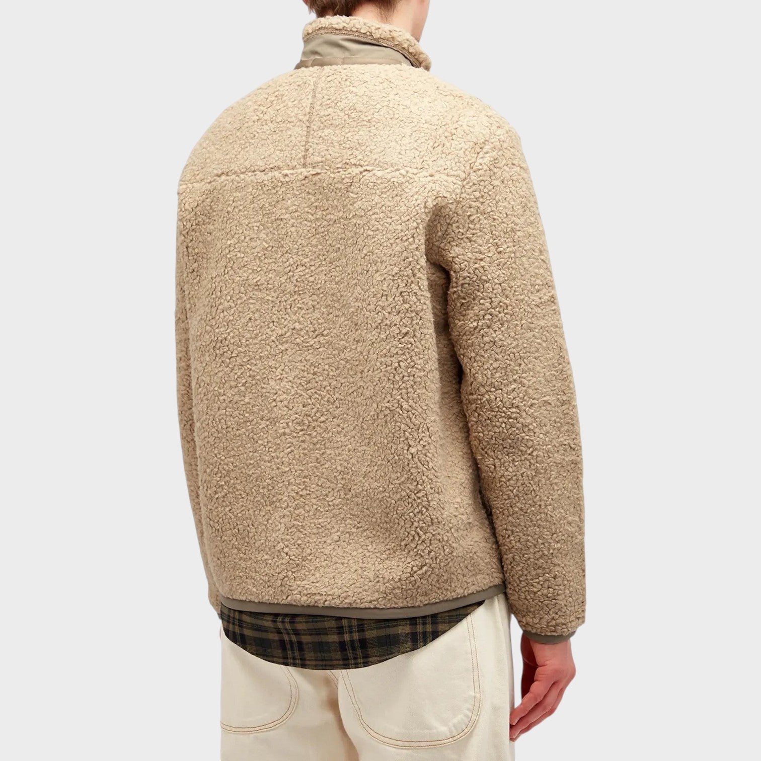 Back view of a Supplied Fashion beige heather fleece zip jacket with textured fabric and a plaid shirt hem