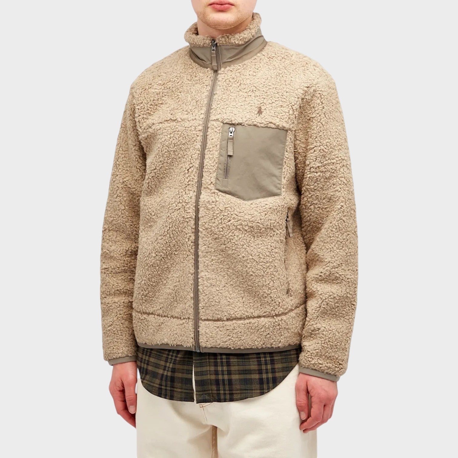 Supplied Fashion Ralph Lauren beige heather fleece zip jacket with a chest pocket worn over a plaid shirt.