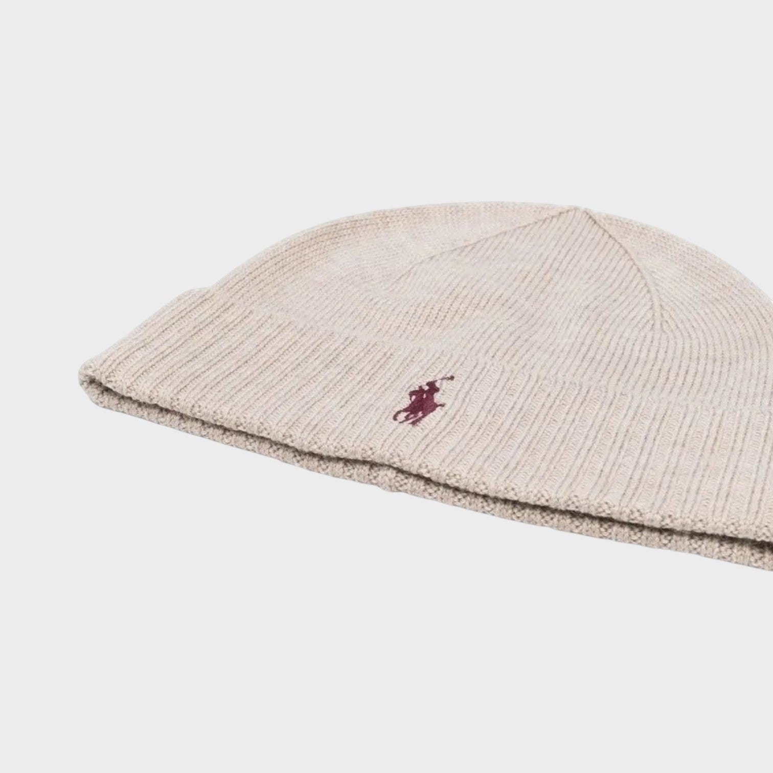 Supplied Fashion natural beige wool beanie with a small embroidered logo detail on the ribbed cuff