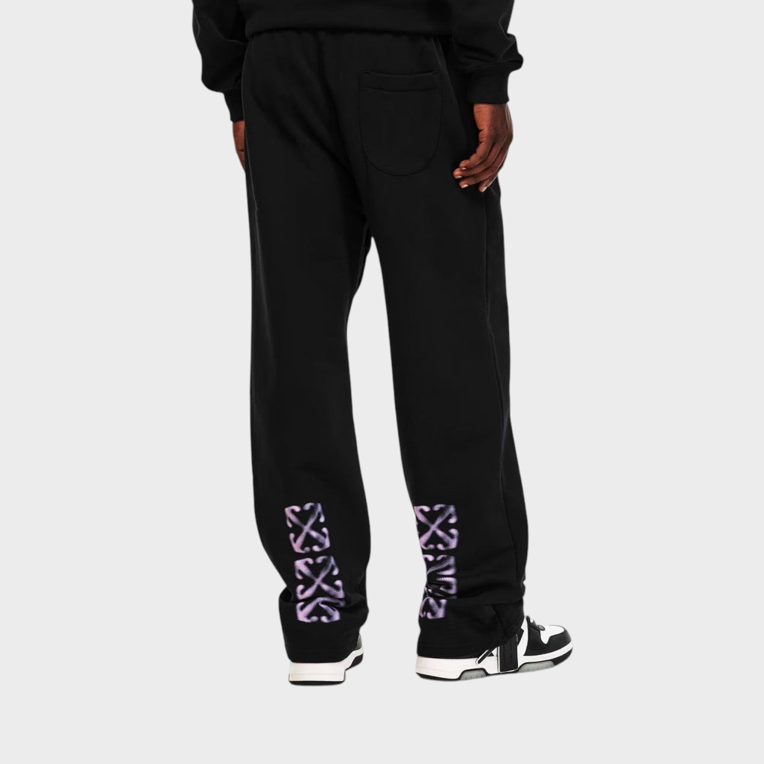 Supplied Fashion black fleece sweatpants with purple arrow branding on the lower legs and a structured closed hem.