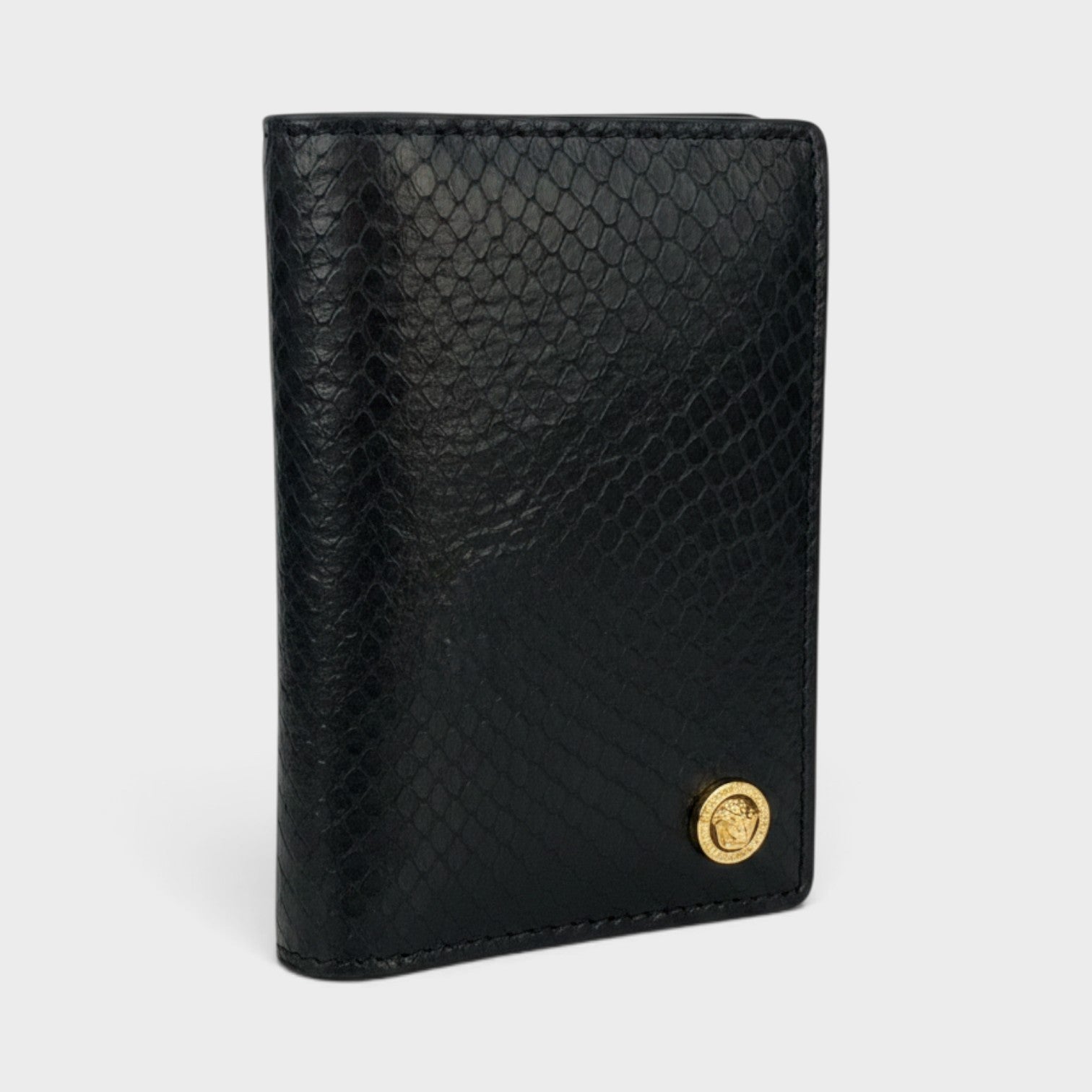 Supplied Fashion black snakeskin-embossed leather card case with a gold Medusa logo emblem.
