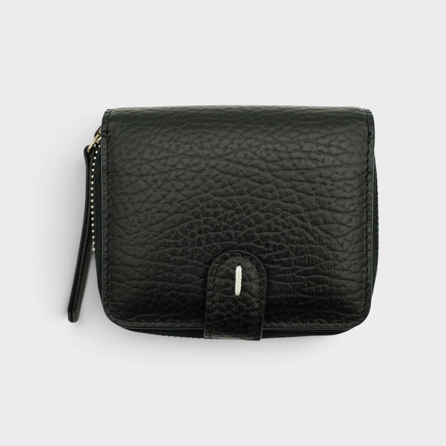 Supplied Fashion black grained leather coin pouch with signature white four-stitch detail and zip closure.