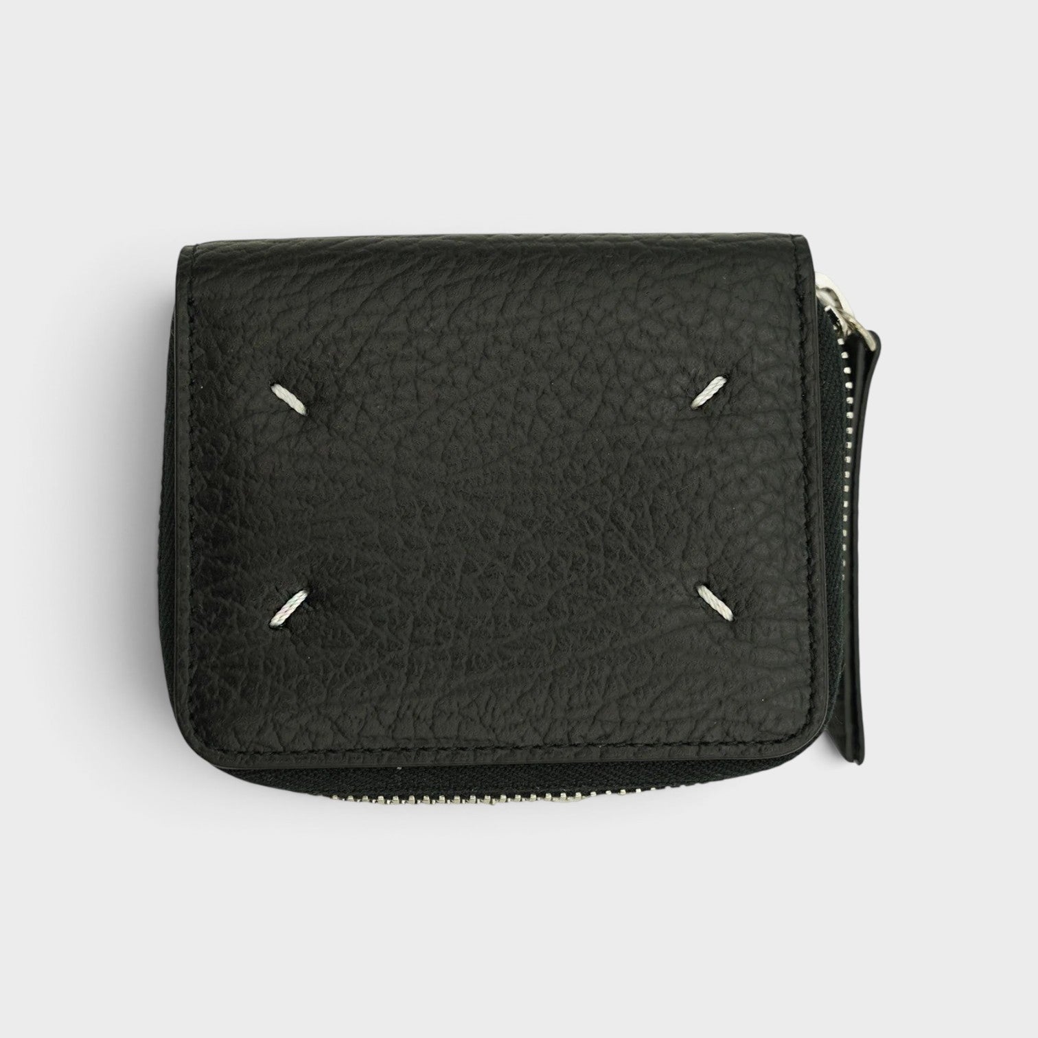 Supplied Fashion black leather coin pouch featuring signature white four-stitch detailing and a side zipper closure.
