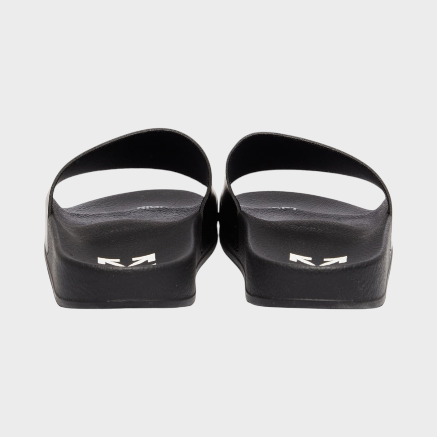 Supplied Fashion black unisex slides featuring white Swimming Man logo detail on the heel, rear view.