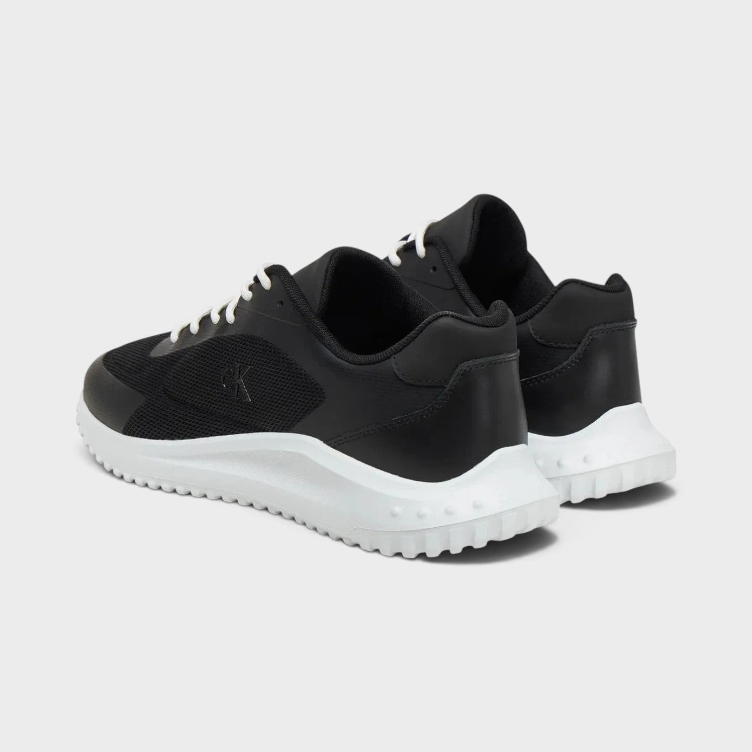 Supplied Fashion Calvin Klein Eva Runner low-top sneakers in black mesh and leather with a white responsive sole