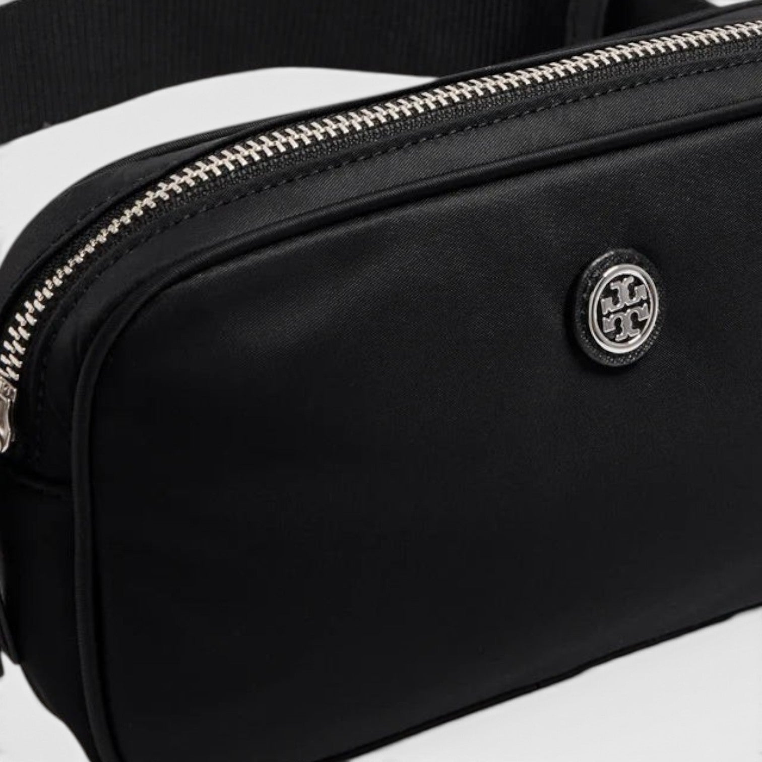Supplied Fashion Virginia black nylon belt bag featuring a silver logo emblem and durable zipper closure.