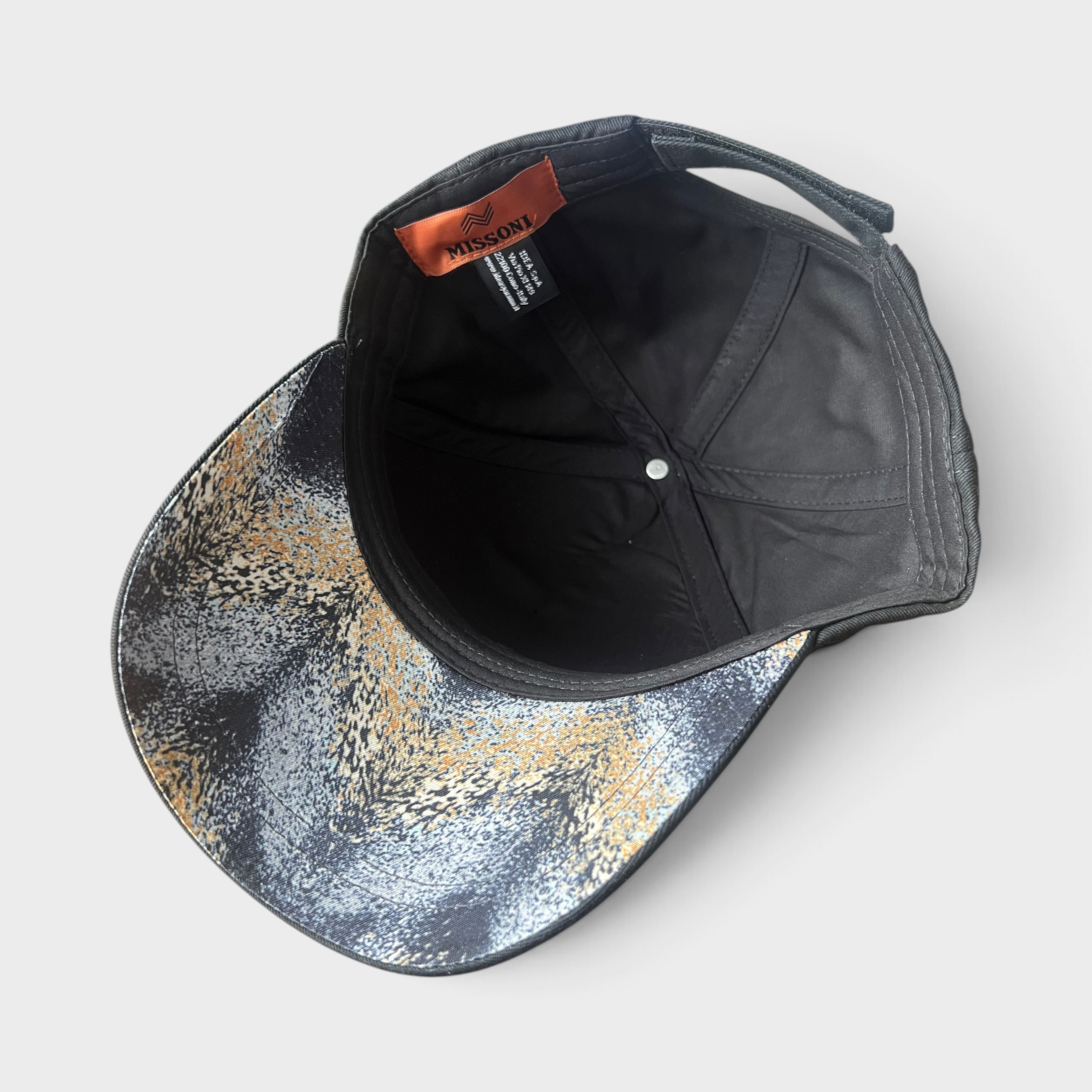 Supplied Fashion black cap with Missoni interior label and patterned brim featuring a metallic zigzag design